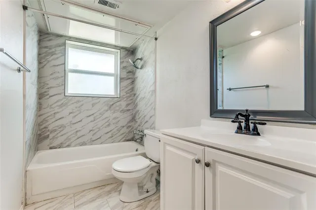 a bathroom with a sink a toilet and a bathtub