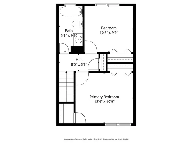 a view of a room with wooden floor a ceiling fan and windows