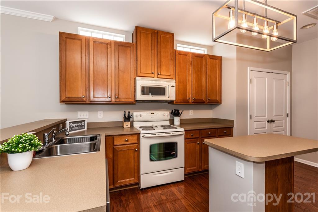 151 Whitley Mills Road Fort Mill, SC 29708 - Photo 11 of 33 a kitchen with a stove a sink and a microwave