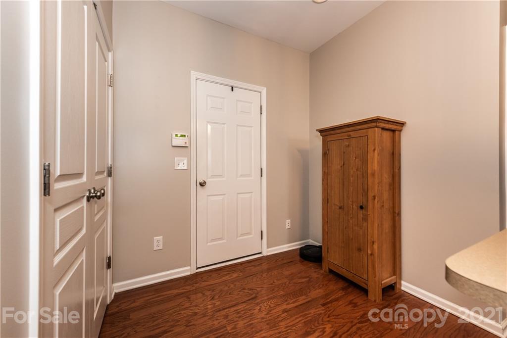 151 Whitley Mills Road Fort Mill, SC 29708 - Photo 15 of 33 a view of an empty room with wooden floor and a bathroom