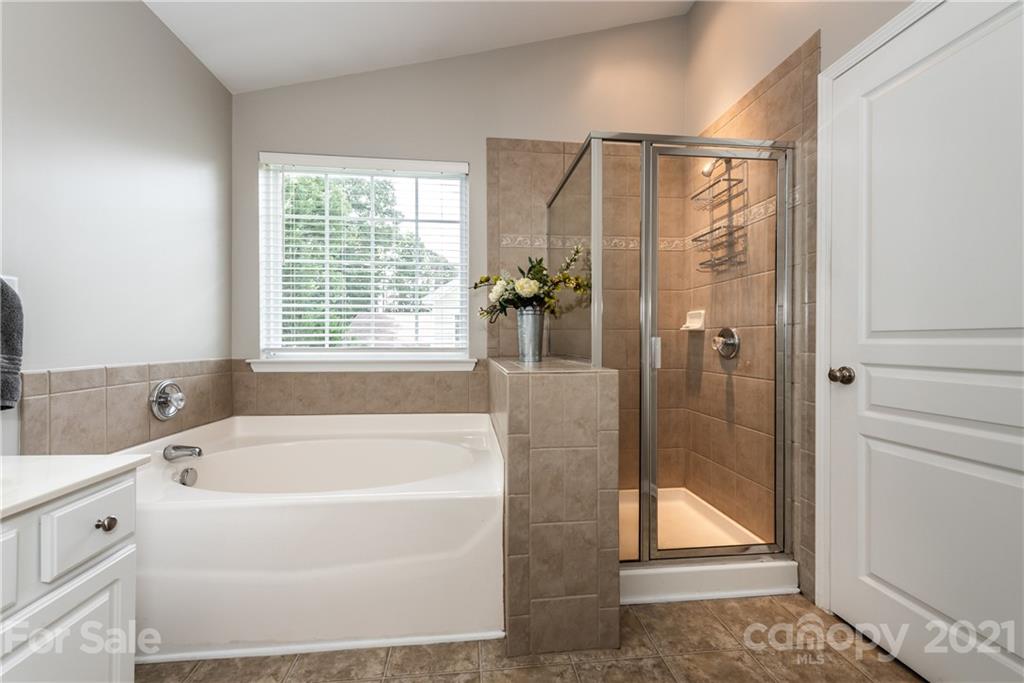 151 Whitley Mills Road Fort Mill, SC 29708 - Photo 21 of 33 a white bath tub sitting next to a shower