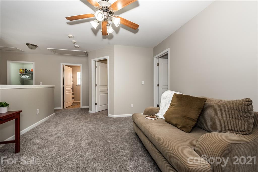 151 Whitley Mills Road Fort Mill, SC 29708 - Photo 24 of 33 a living room with furniture and a ceiling fan