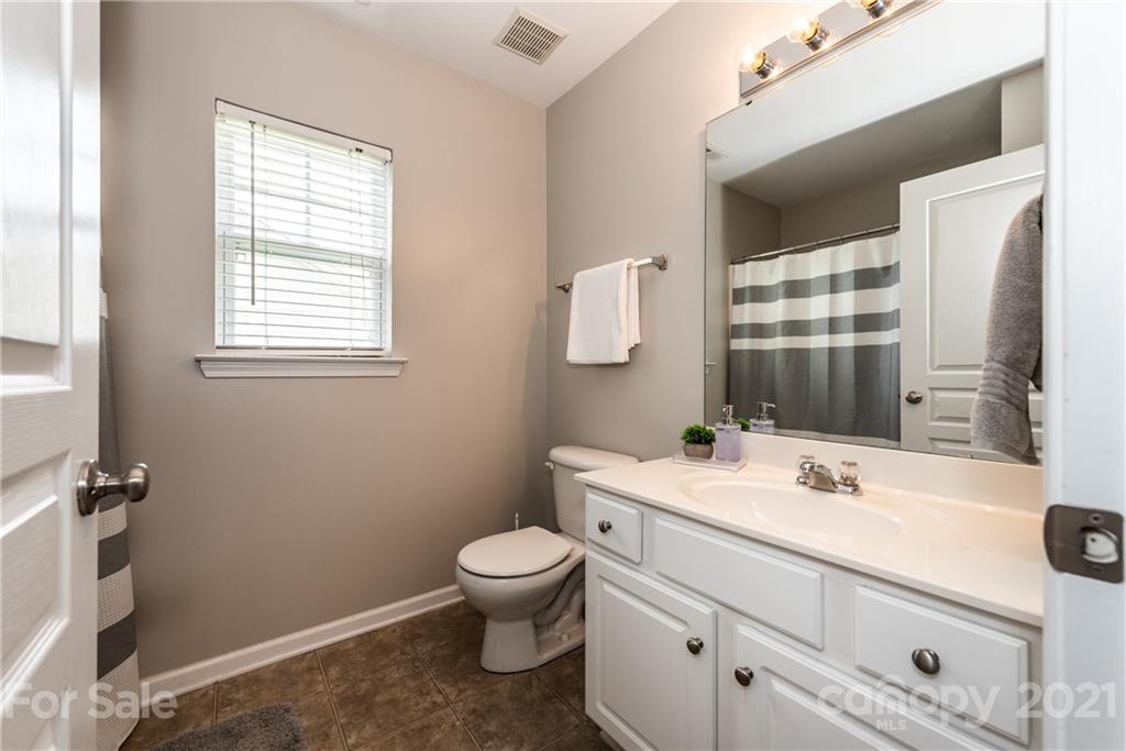 151 Whitley Mills Road Fort Mill, SC 29708 - Photo 27 of 33 a bathroom with a sink toilet and mirror