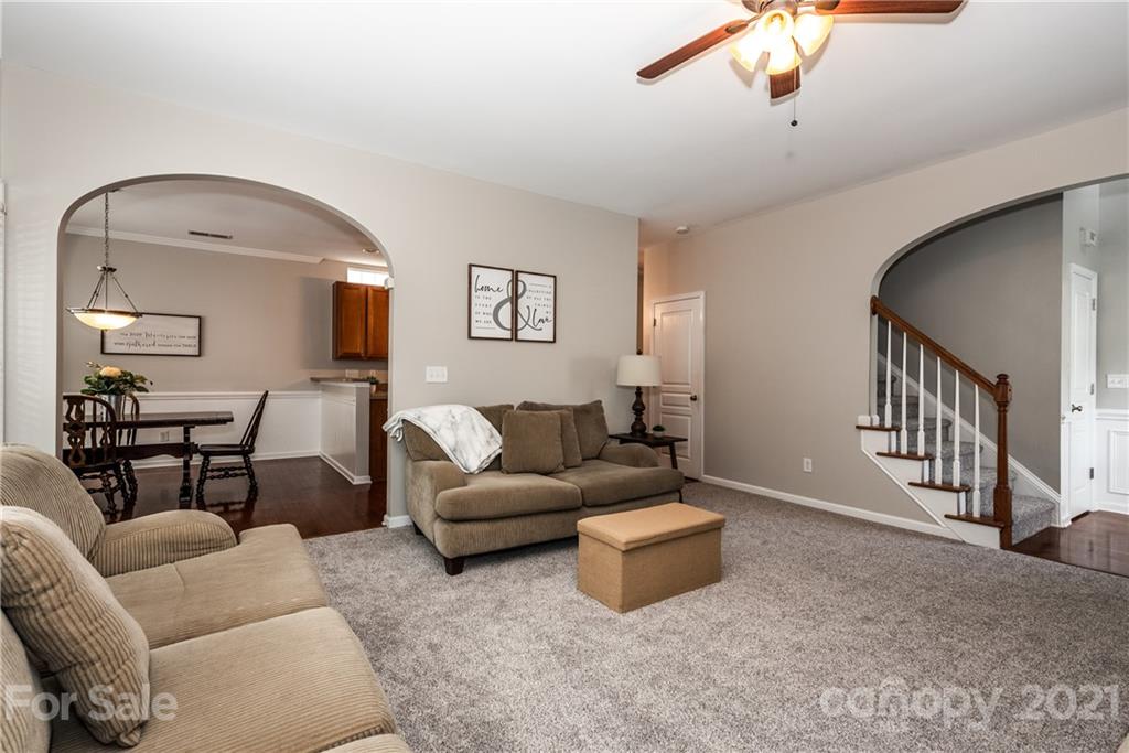 151 Whitley Mills Road Fort Mill, SC 29708 - Photo 7 of 33 a living room with furniture and a wooden floor