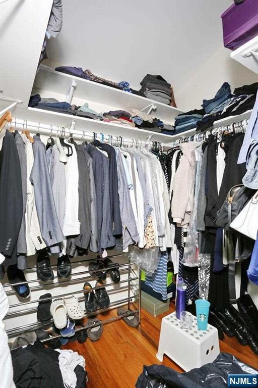 84 12th Street Cresskill, NJ 07626 - Photo 30 of 45 a view of walk in closet with clothes and shoes
