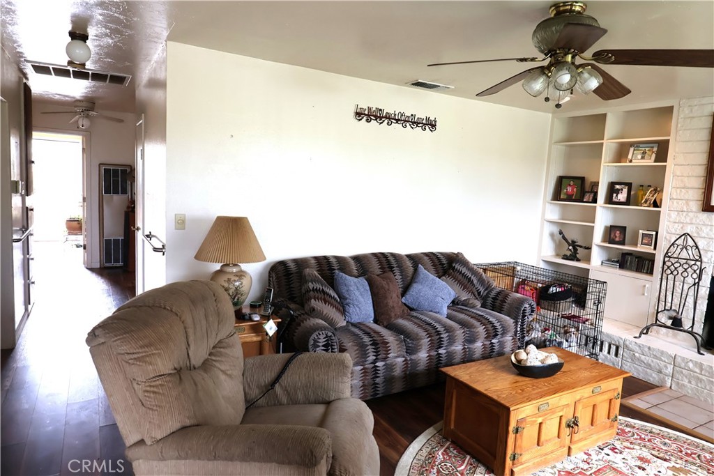 1409 North Street Corning, CA 96021 - Photo 12 of 40 a living room with furniture and a lamp