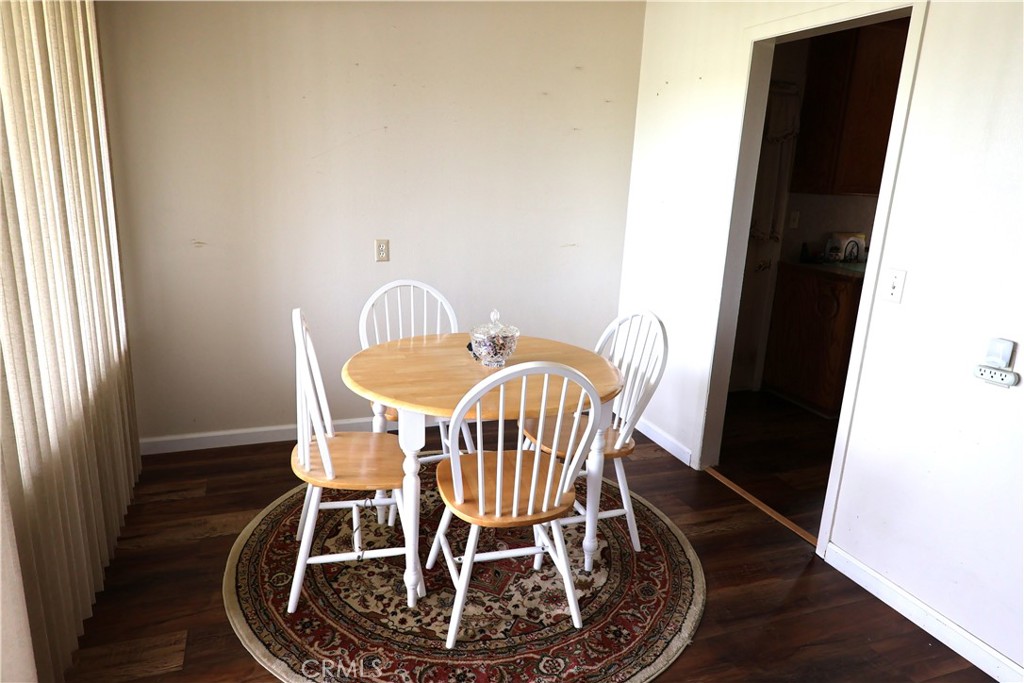 1409 North Street Corning, CA 96021 - Photo 14 of 40 a view of a dining room with furniture and wooden floor