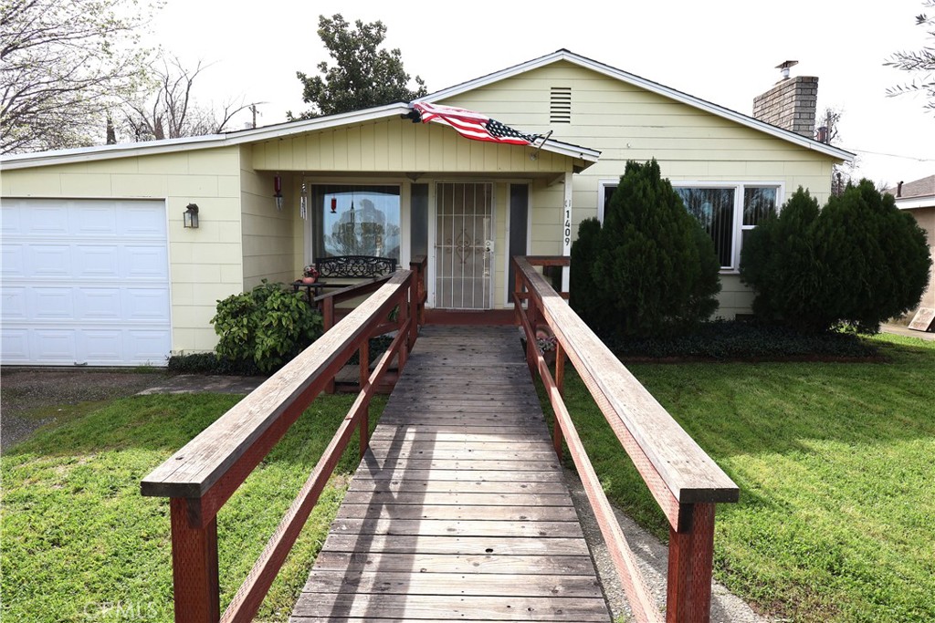 1409 North Street Corning, CA 96021 - Photo 18 of 40 a view of house with swimming pool
