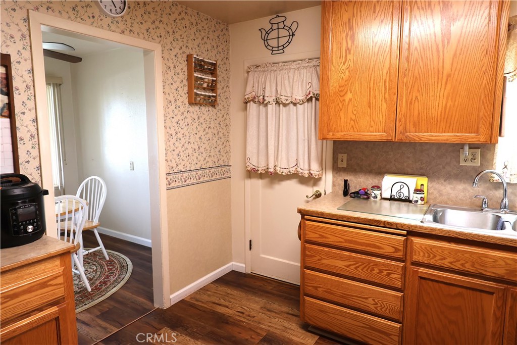 1409 North Street Corning, CA 96021 - Photo 20 of 40 a kitchen with a refrigerator and a cabinets