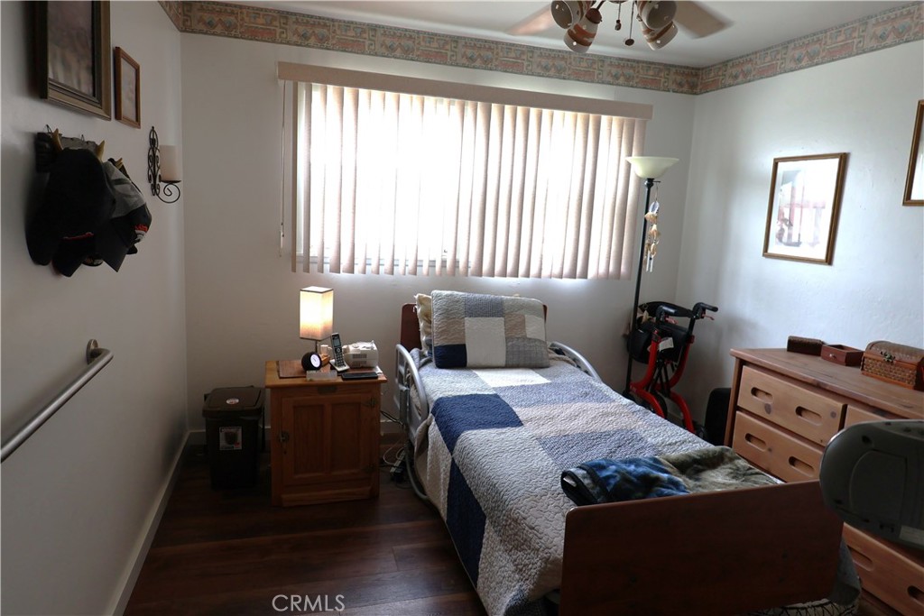 1409 North Street Corning, CA 96021 - Photo 22 of 40 a bedroom with a bed and a window