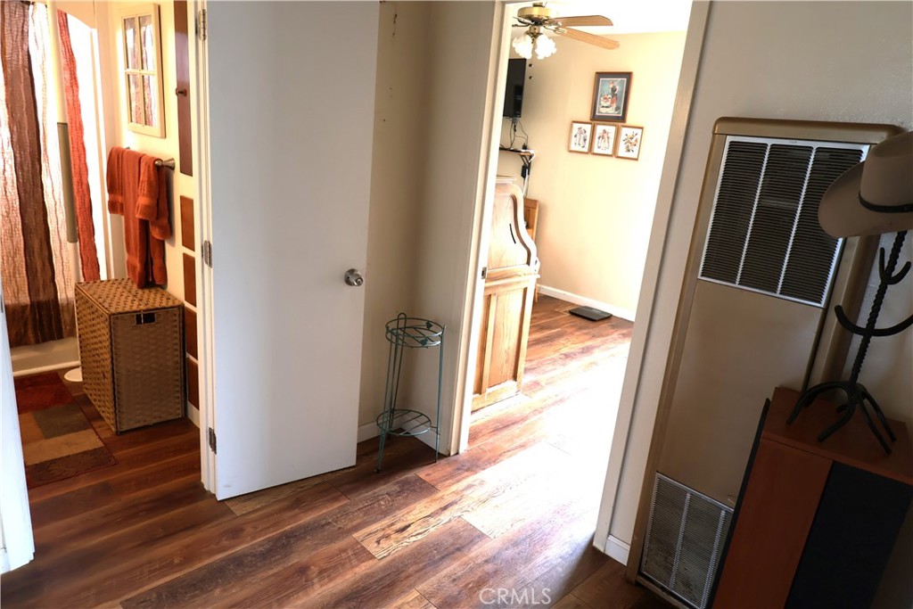 1409 North Street Corning, CA 96021 - Photo 23 of 40 a view of a hallway with wooden floor and stairs