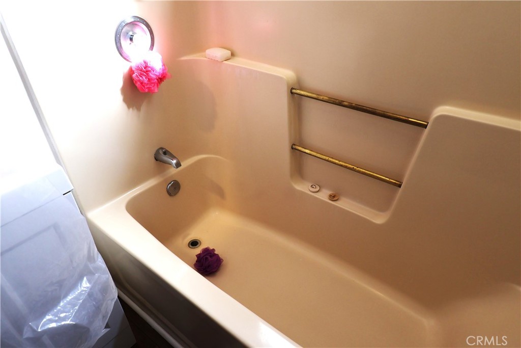 1409 North Street Corning, CA 96021 - Photo 25 of 40 a bathroom with a tub and sink