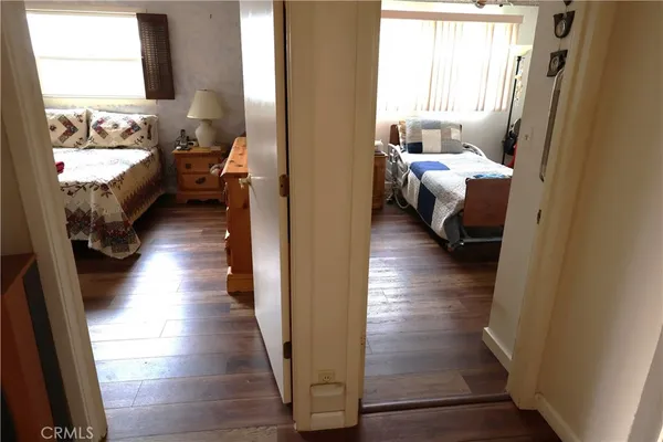 a bedroom with bed and a window