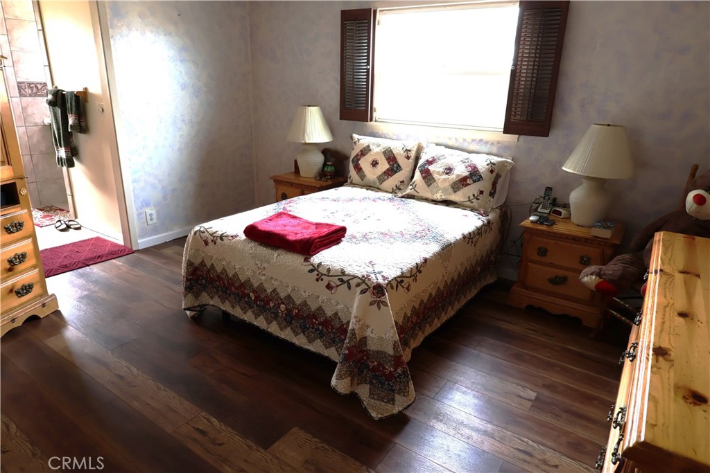 1409 North Street Corning, CA 96021 - Photo 32 of 40 a bed sitting in a bedroom next to a window