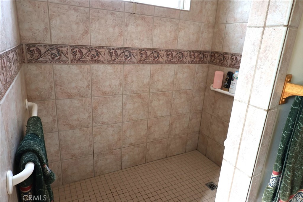 1409 North Street Corning, CA 96021 - Photo 34 of 40 a bathroom with a shower and a sink