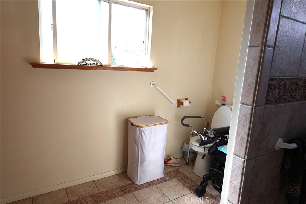1409 North Street Corning, CA 96021 - Photo 37 of 40 a bathroom with a toilet
