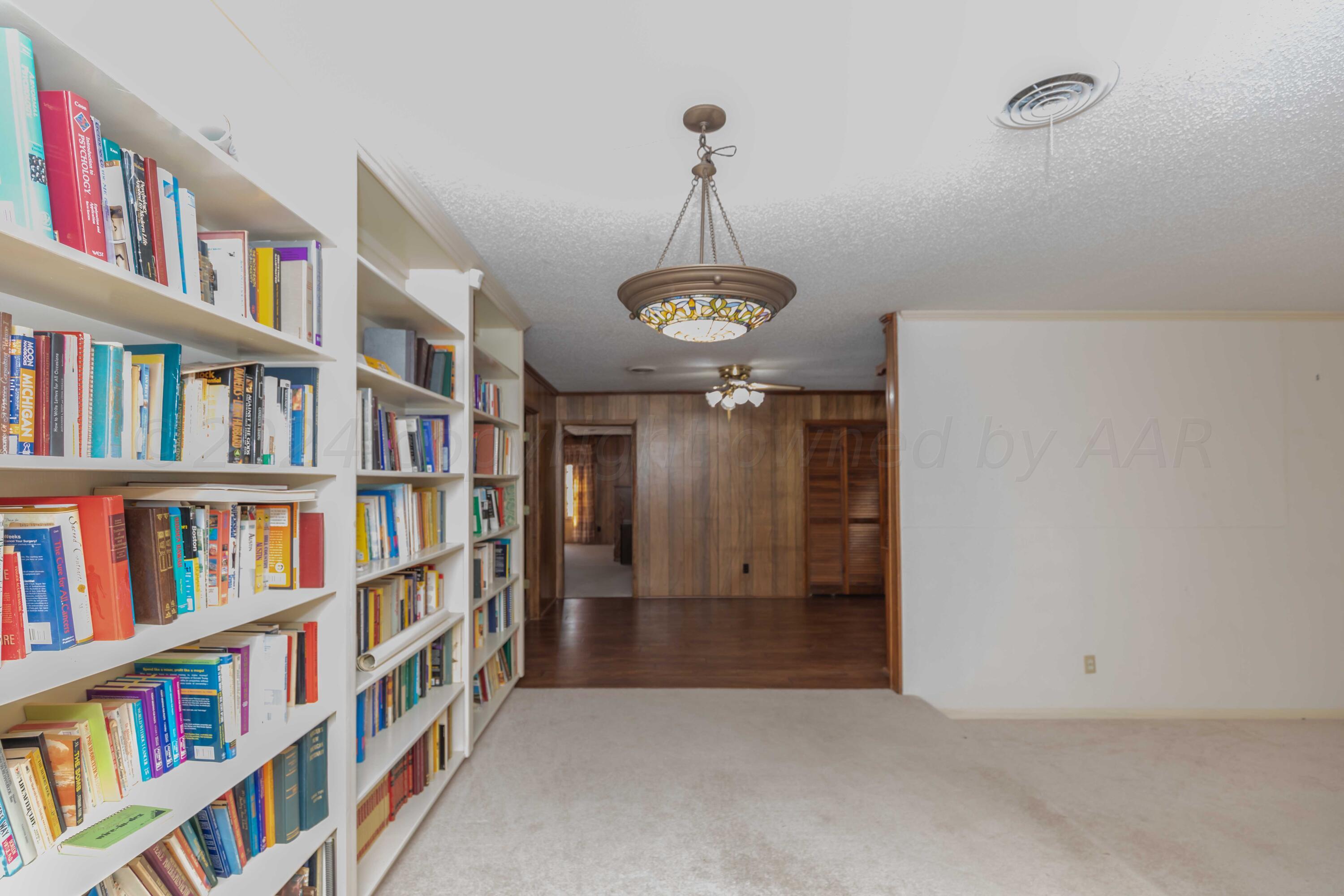 4400 Gem Lake Road Amarillo, TX 79106 - Photo 13 of 57 a view of an empty room with shelves