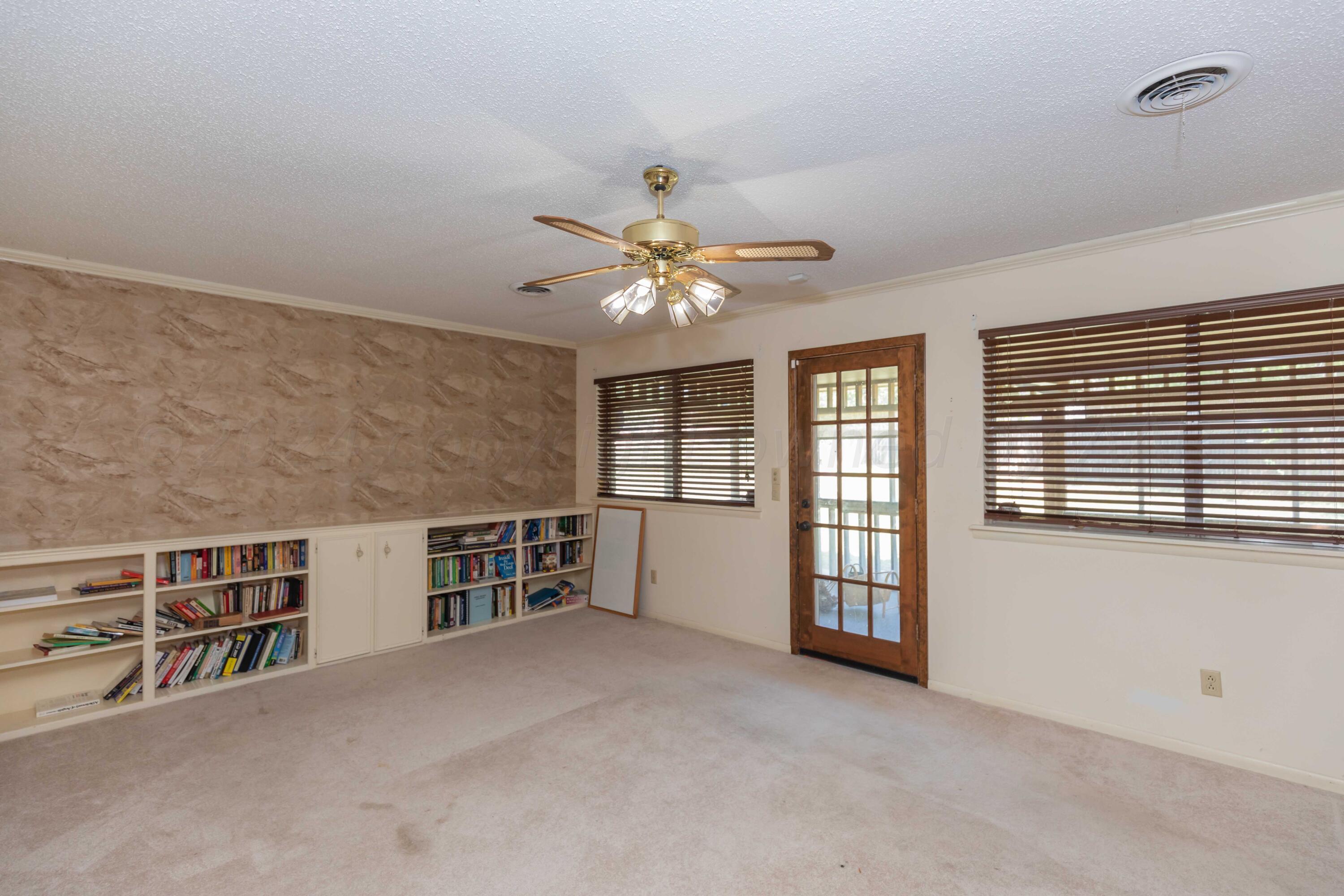 4400 Gem Lake Road Amarillo, TX 79106 - Photo 18 of 57 a view of an empty room with a window