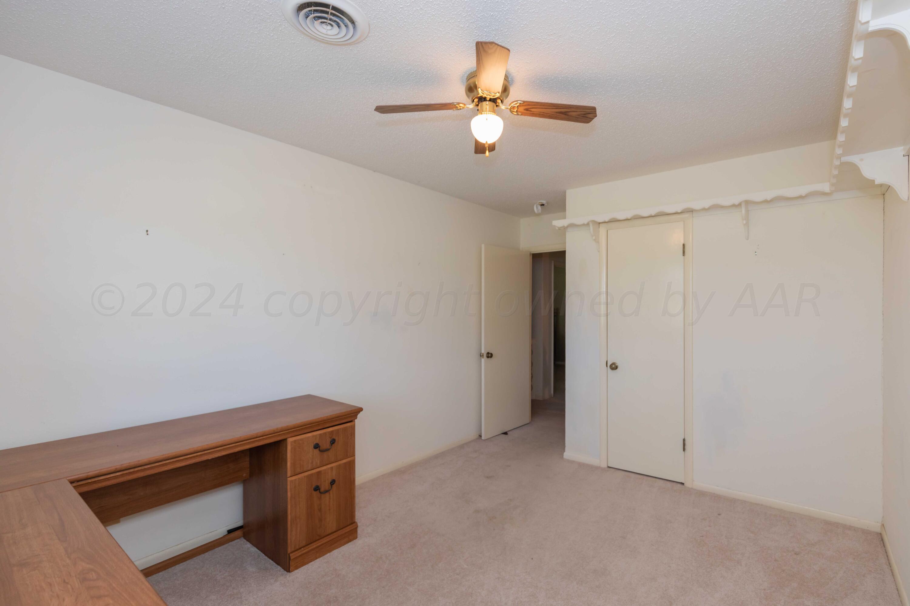4400 Gem Lake Road Amarillo, TX 79106 - Photo 29 of 57 a view of room with window and ceiling fan