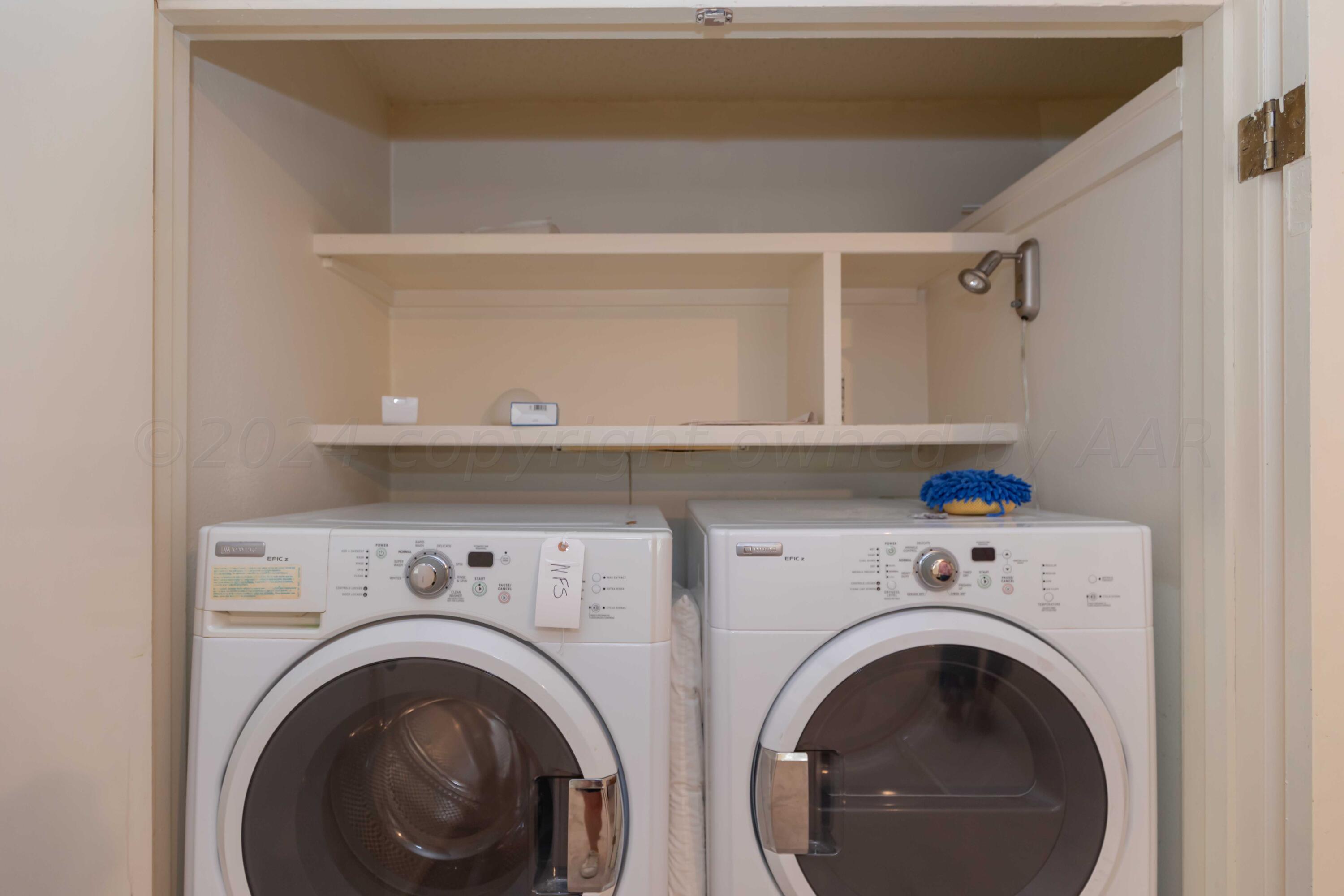 4400 Gem Lake Road Amarillo, TX 79106 - Photo 44 of 57 a utility room with dryer and washer