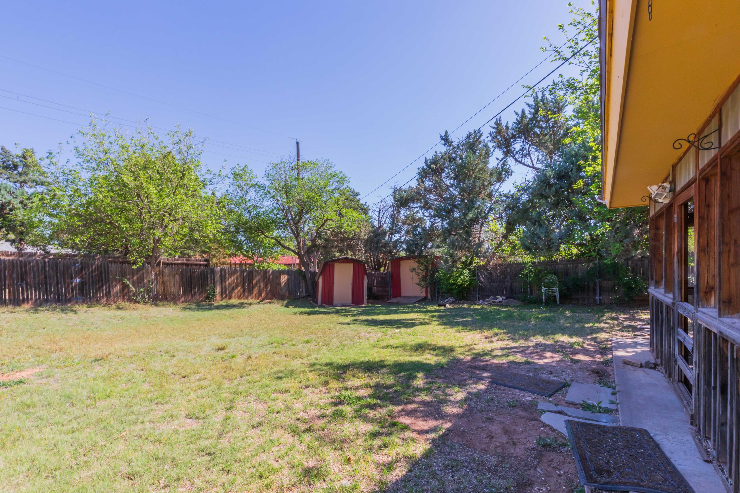 4400 Gem Lake Road Amarillo, TX 79106 - Photo 52 of 57 a view of swimming pool with a yard and large trees