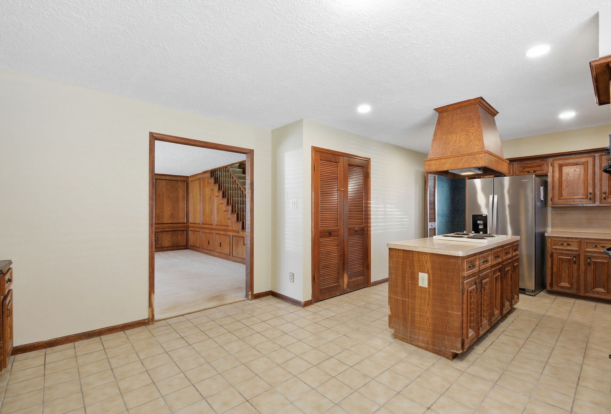 3607 El James Drive Spring, TX 77388 - Photo 15 of 50 View of the kitchen from the dining space looking toward the living room. While still open to the living room, this kitchen is shielded just enough that you don't have to keep your kitchen looking perfect all the time. Note the recessed lighting.