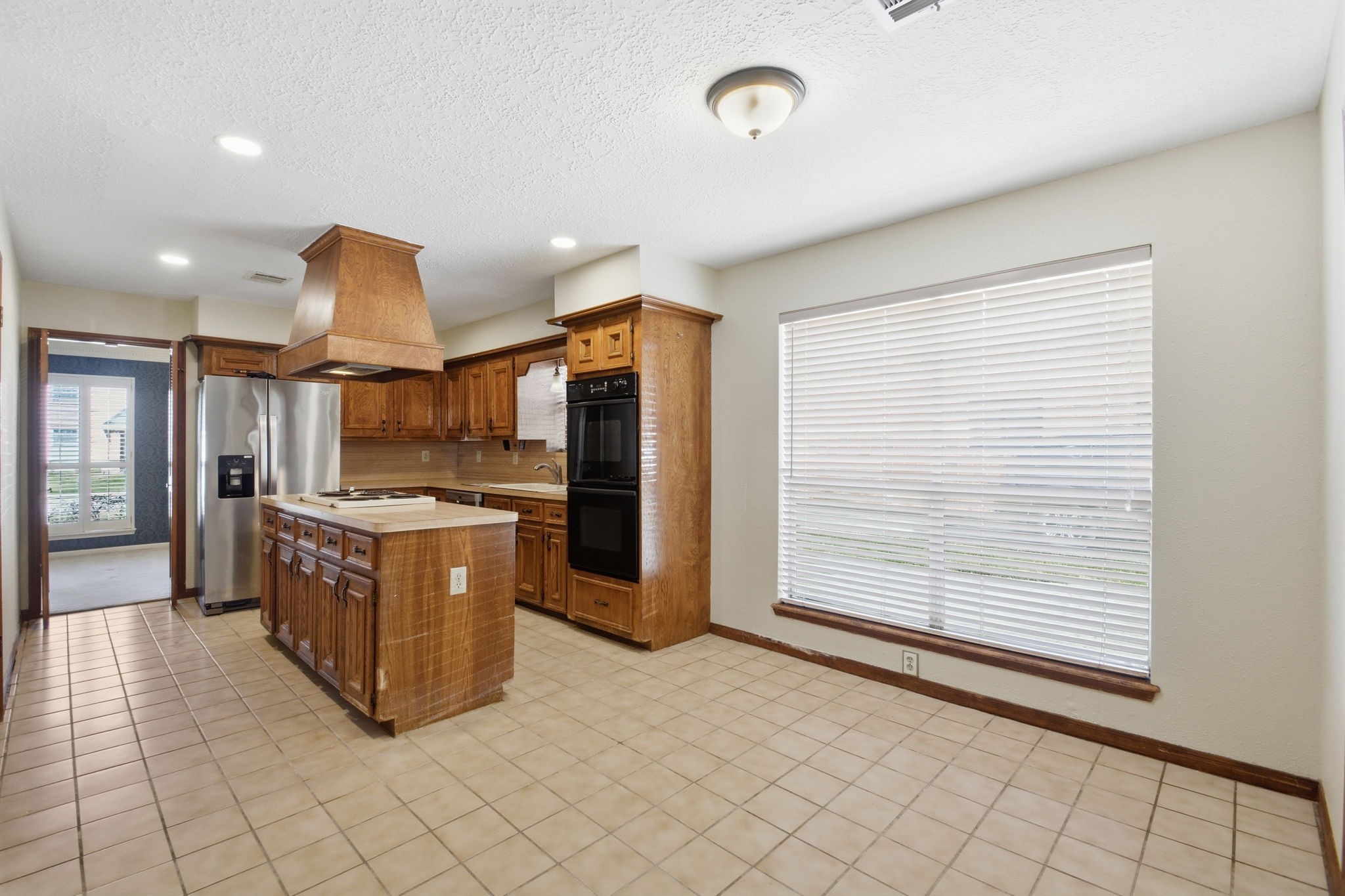 3607 El James Drive Spring, TX 77388 - Photo 16 of 50 Kitchen view as seen from the built-ins and highlighting the spacious dining area and huge window.