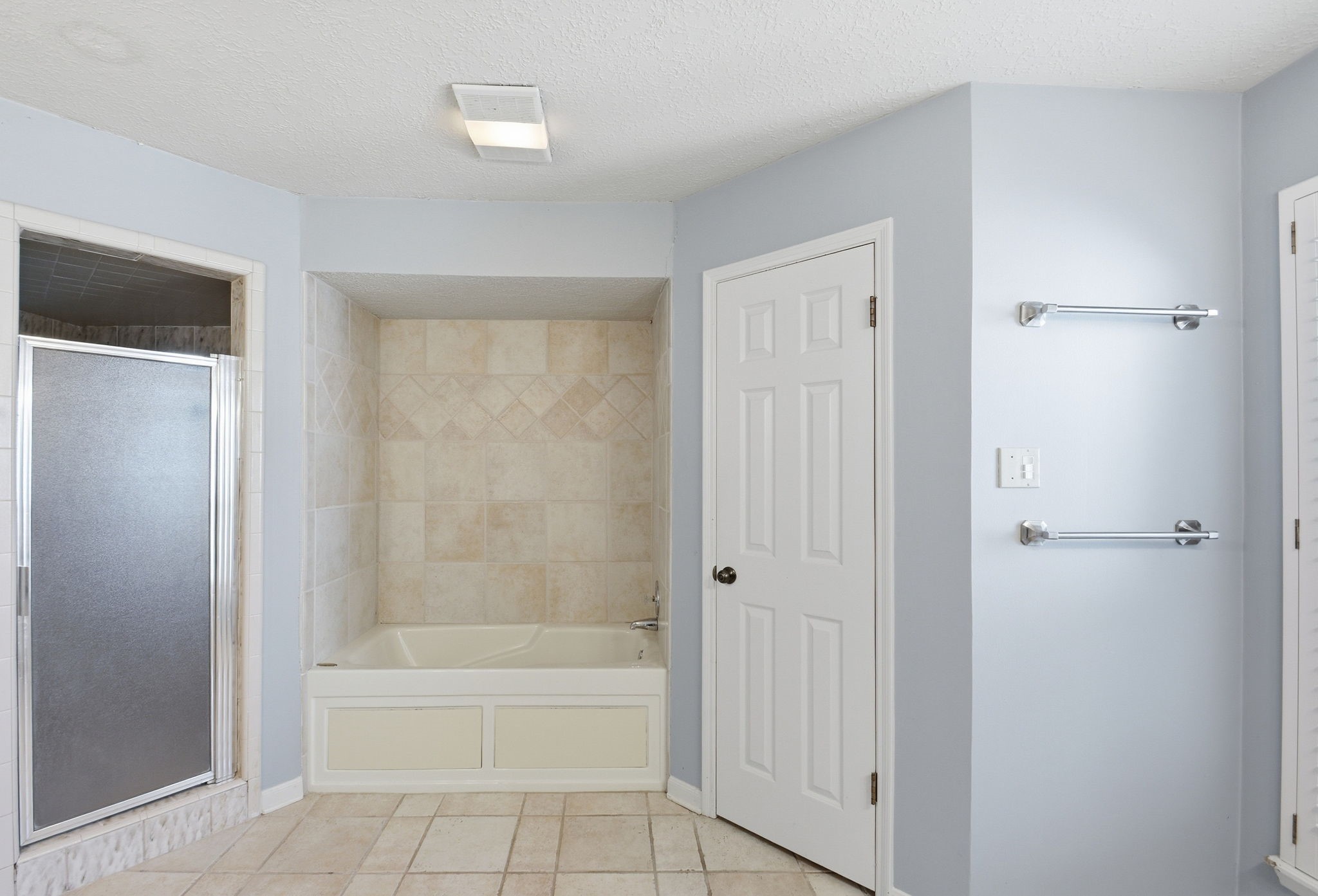 3607 El James Drive Spring, TX 77388 - Photo 23 of 50 Updated primary en-suite bathroom has a jetted tub in the middle, a separate large shower on the left and a second walk-in closet on the right.