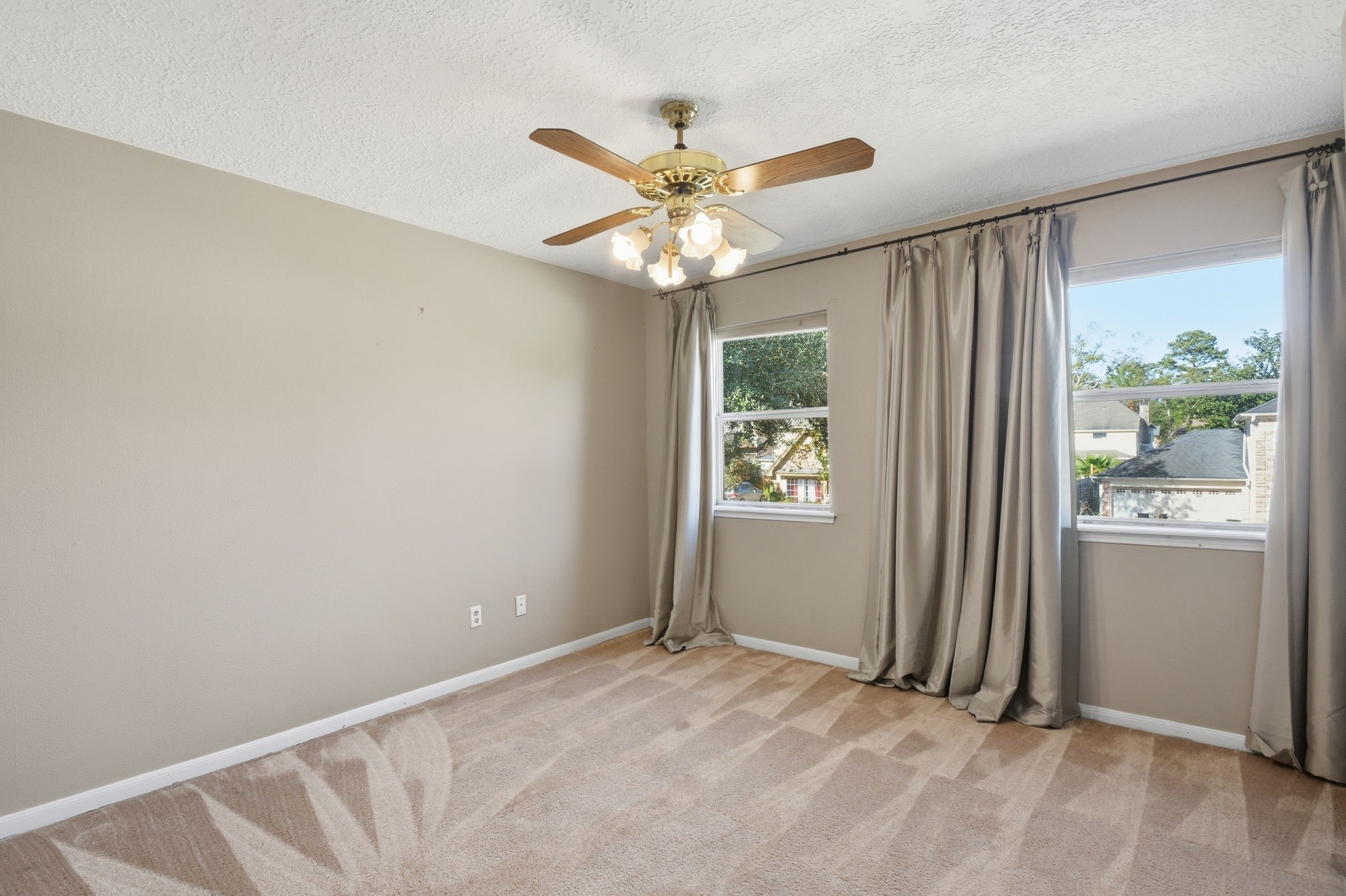 3607 El James Drive Spring, TX 77388 - Photo 28 of 50 One of the three bedrooms upstairs. This one is the first one you come to and has a cute built-in desk with shelving and a ceiling fan. The wood has been painted white in this room.