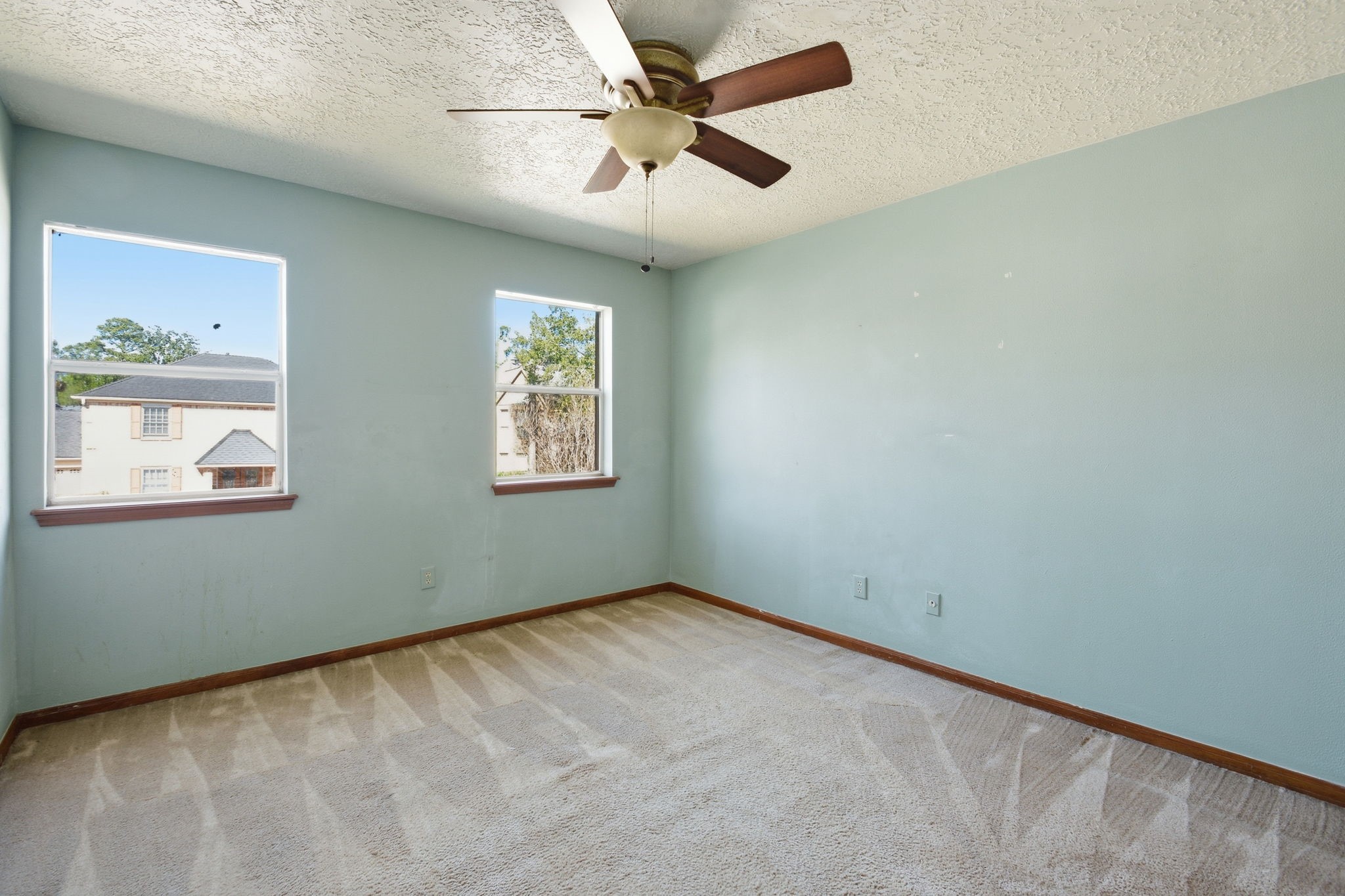 3607 El James Drive Spring, TX 77388 - Photo 32 of 50 Bedroom two of three bedrooms upstairs. It has a walk-in closet and a ceiling fan.