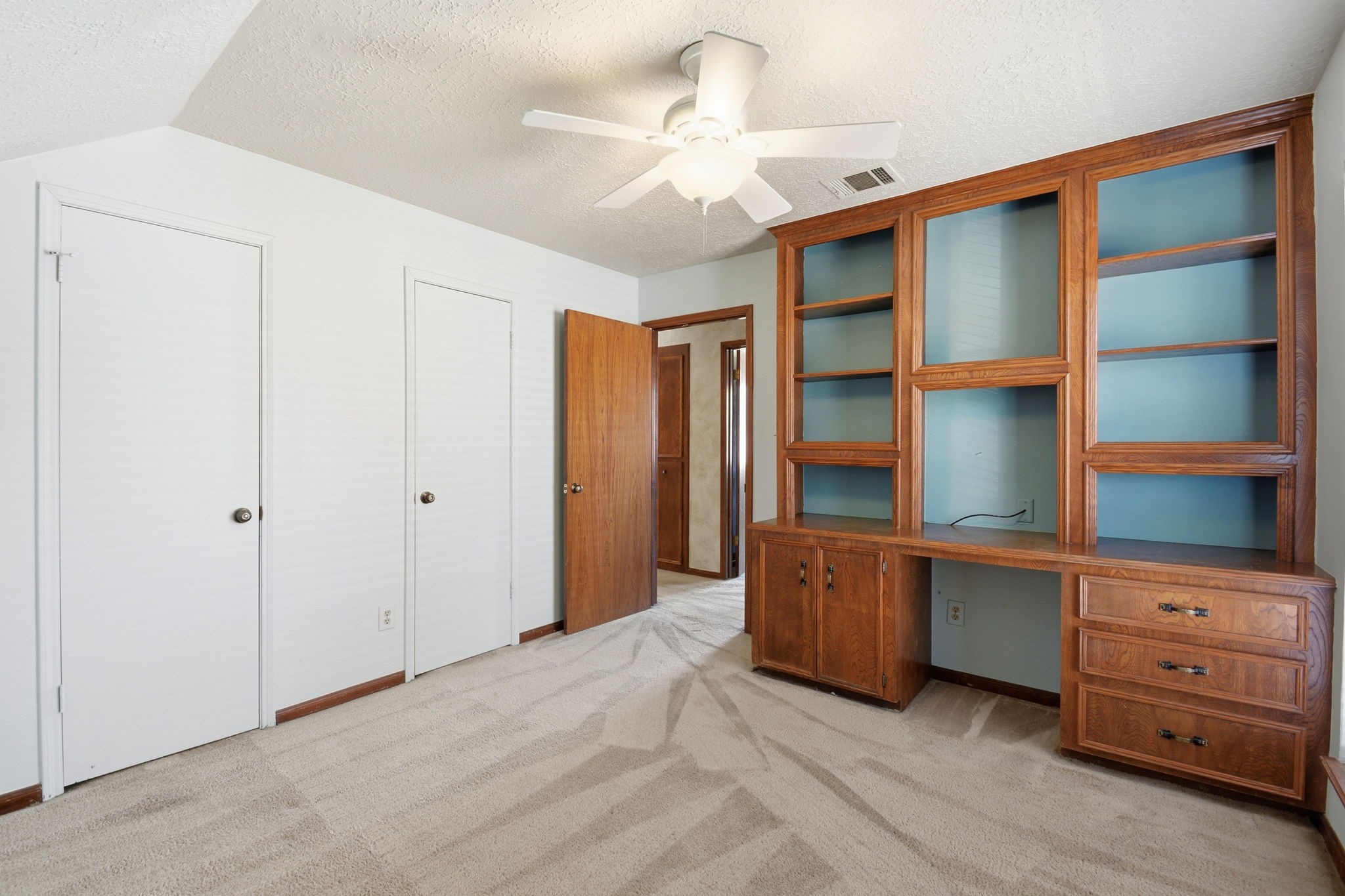 3607 El James Drive Spring, TX 77388 - Photo 35 of 50 This view shows the built-in shelving and desk of bedroom three (of three upstairs bedrooms).