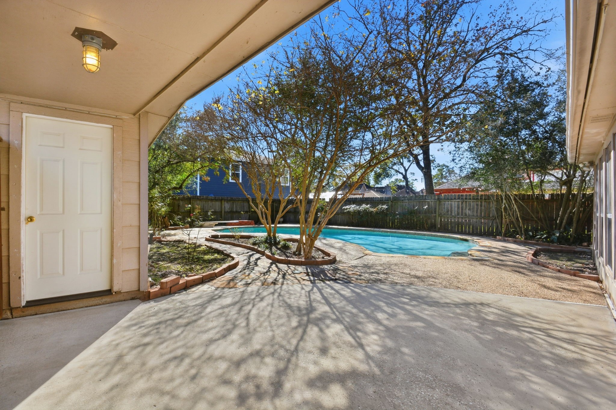 3607 El James Drive Spring, TX 77388 - Photo 41 of 50 View of the covered and fenced-in private walkway that leads fro the detached garage. Pool in the background.