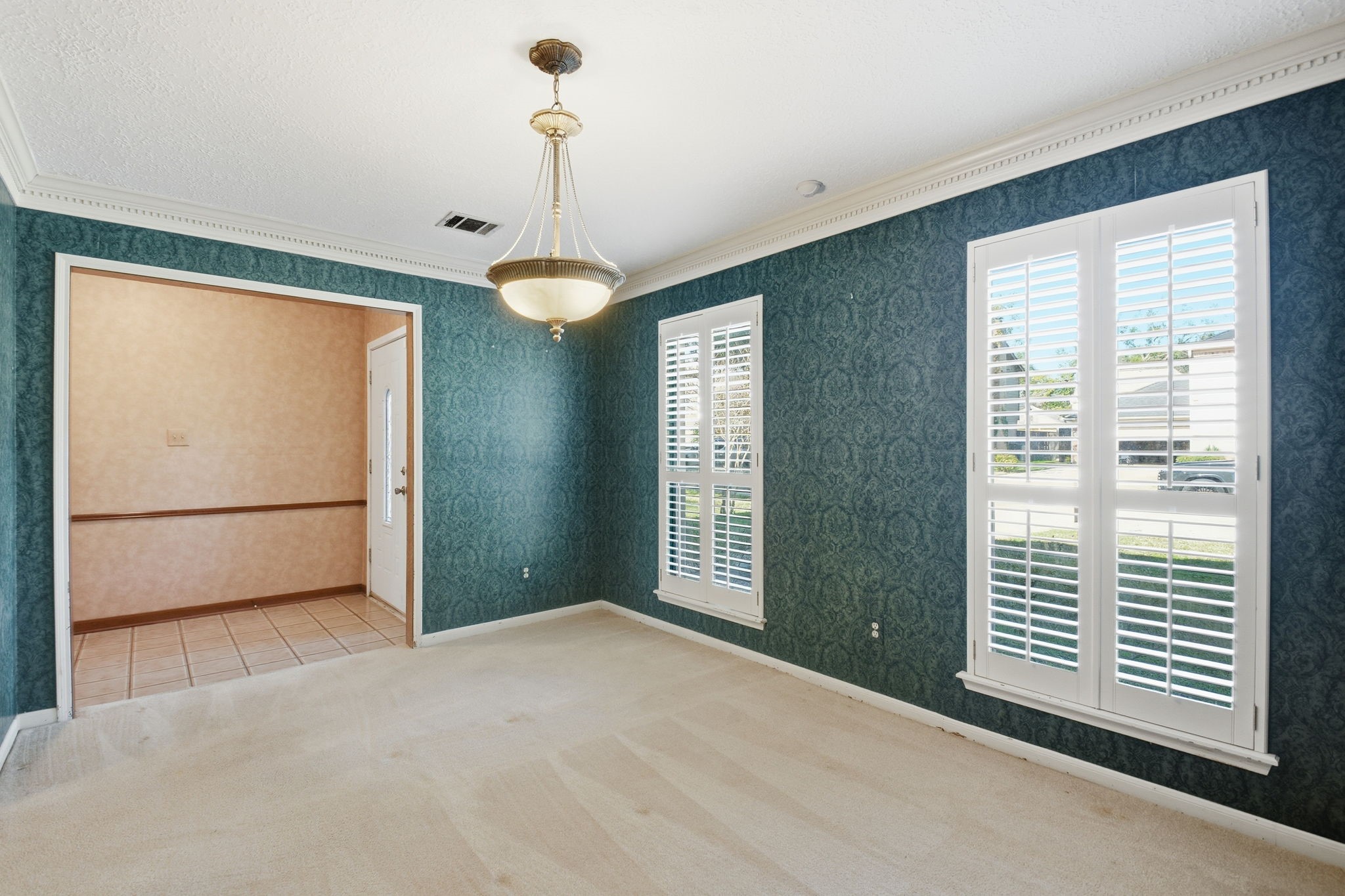 3607 El James Drive Spring, TX 77388 - Photo 7 of 50 Another view of the large formal dining room, this one looking toward the foyer. On the left just out of frame is an entryway to the kitchen. Plantation Shutters and crown molding add to this pretty room that could easily be used as a home office.