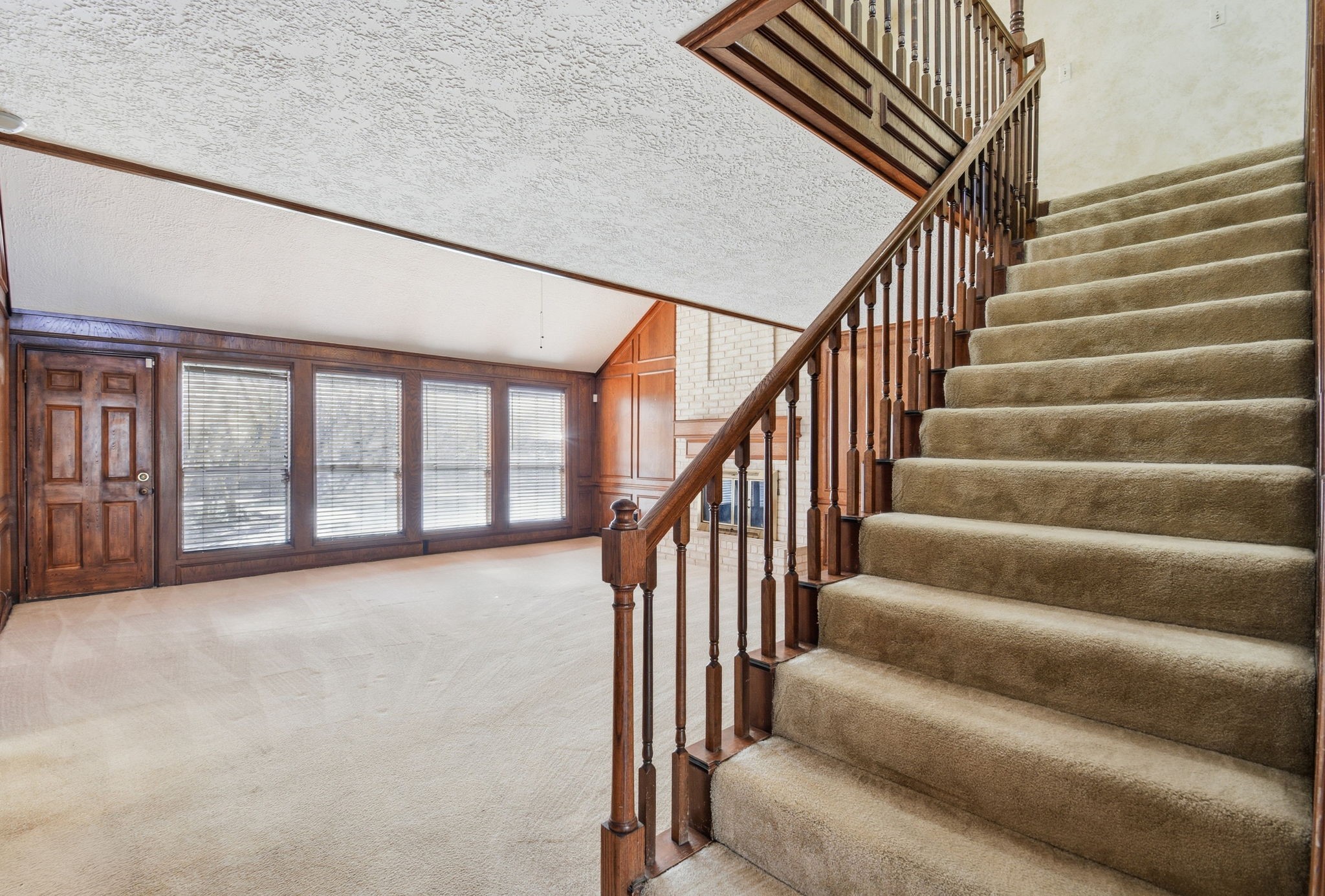 3607 El James Drive Spring, TX 77388 - Photo 8 of 50 As you exit the foyer, you get your first glimpse of the wall of windows looking out to the pool. There is also a door leading directly out to the backyard from the living room.