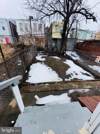 a view of a building with a yard