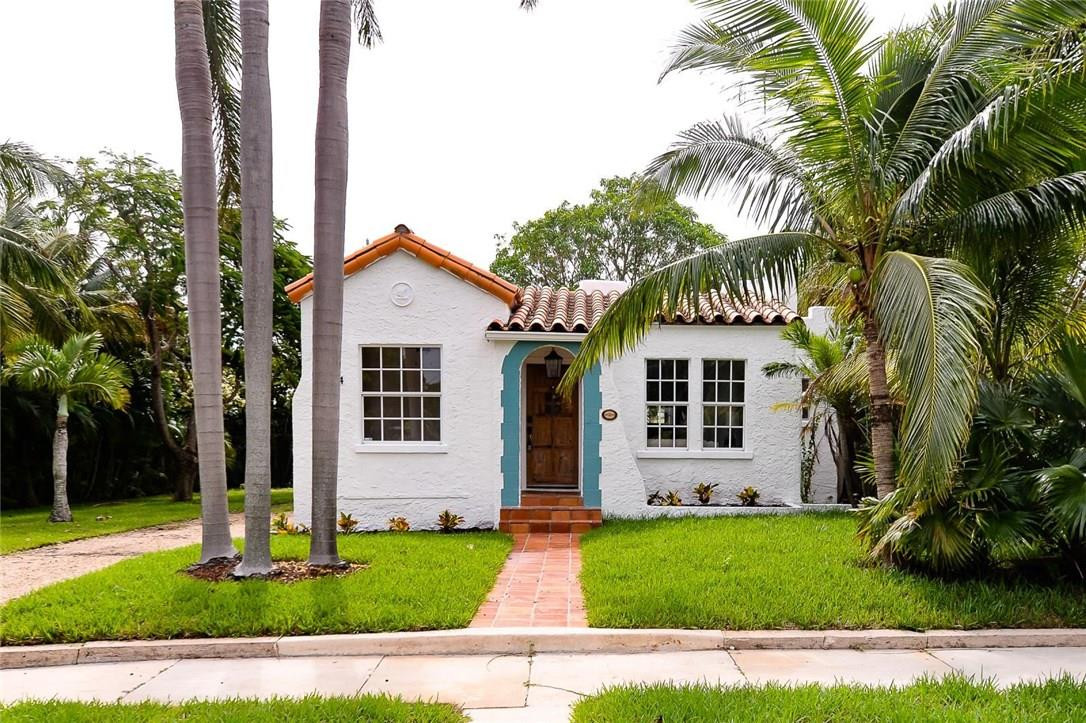 734 Avon Road West Palm Beach, FL 33401 - Photo 1 of 26 a view of a house with a yard and palm trees