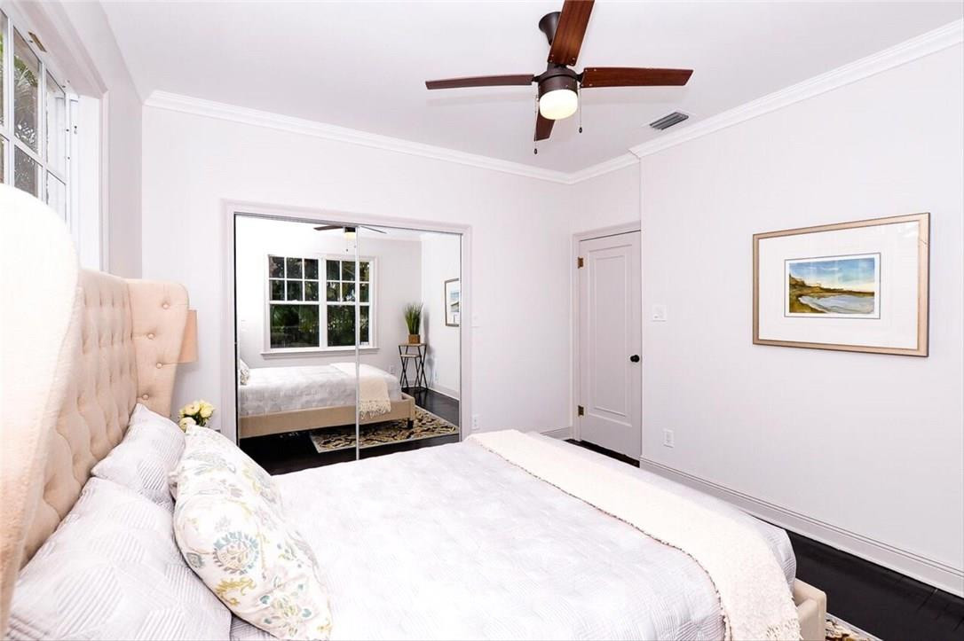 734 Avon Road West Palm Beach, FL 33401 - Photo 12 of 26 a bedroom with a large bed and a window