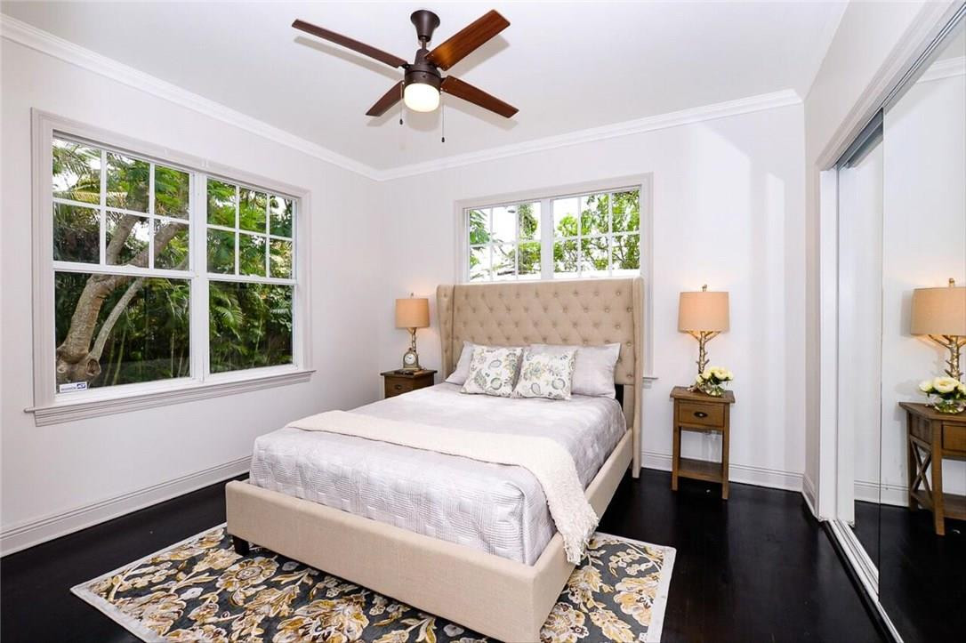 734 Avon Road West Palm Beach, FL 33401 - Photo 13 of 26 a bedroom with a large bed and a window