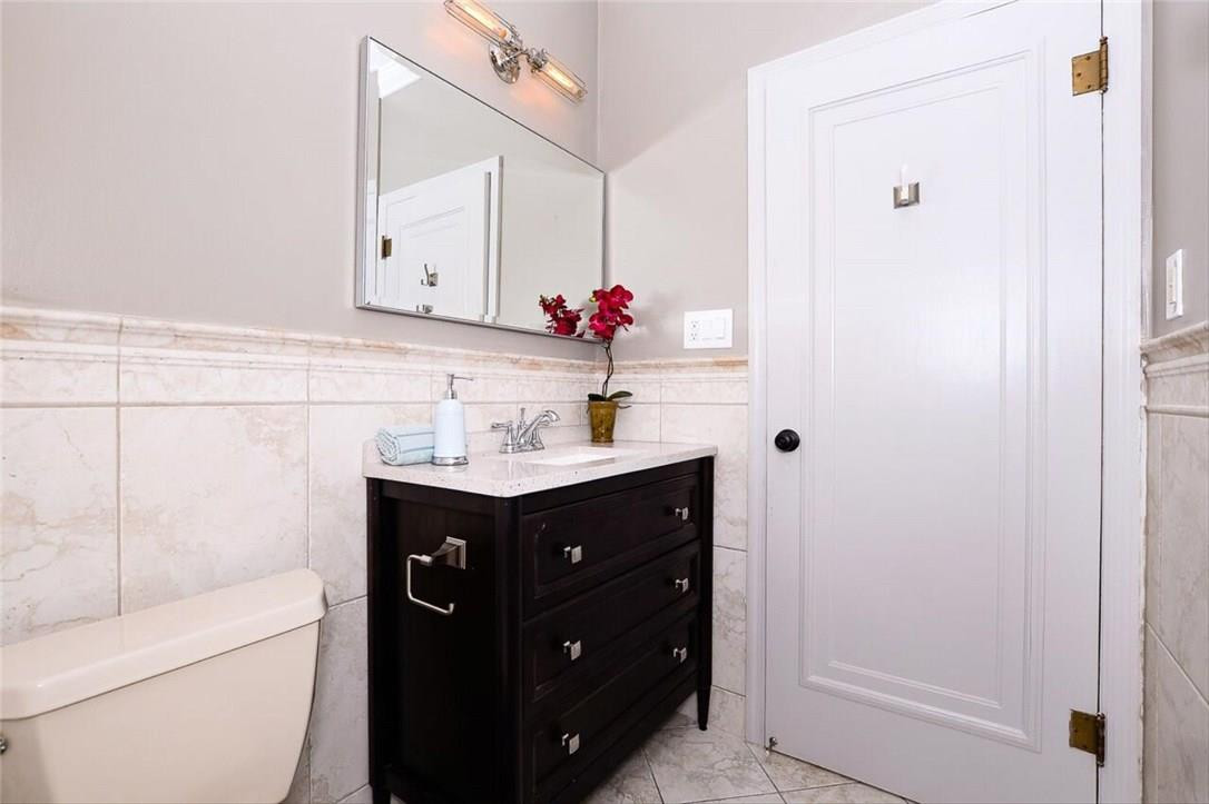 734 Avon Road West Palm Beach, FL 33401 - Photo 15 of 26 a bathroom with a sink vanity and a mirror