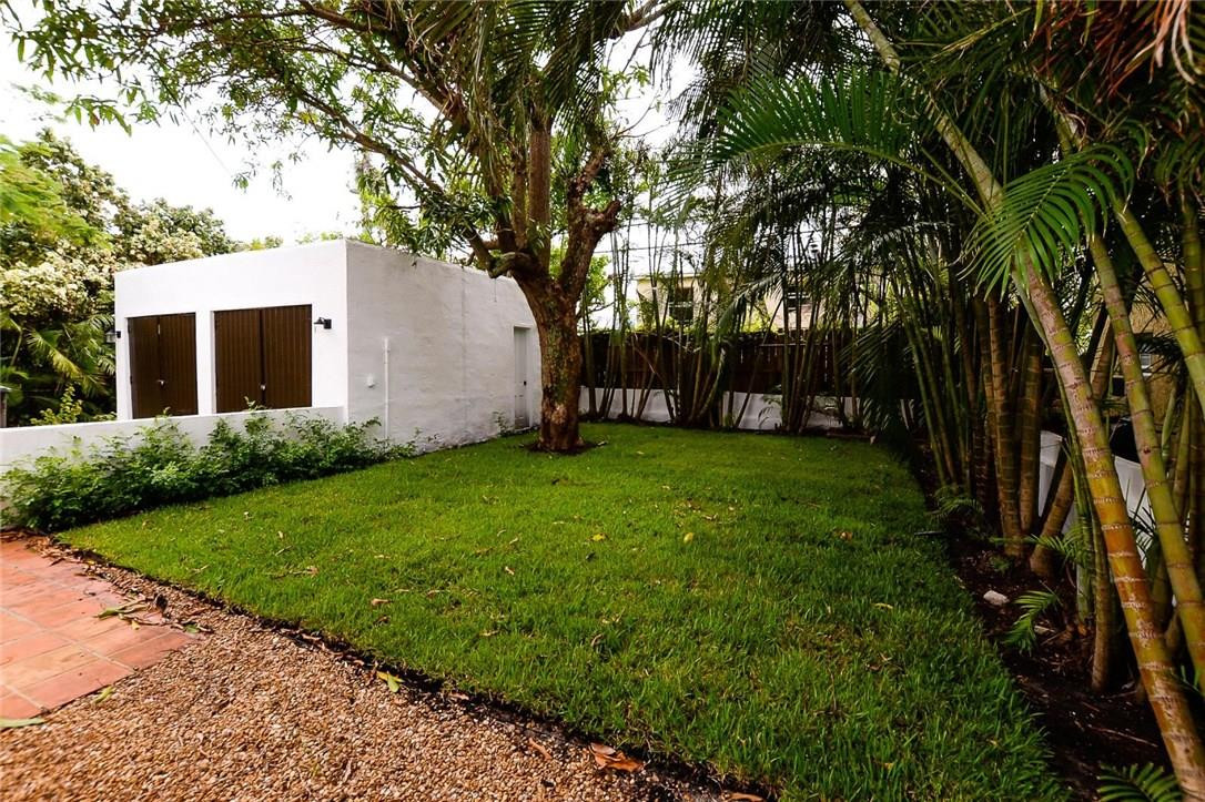 734 Avon Road West Palm Beach, FL 33401 - Photo 24 of 26 a view of a backyard with large trees
