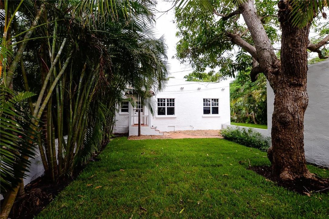 734 Avon Road West Palm Beach, FL 33401 - Photo 25 of 26 a view of a backyard with a large tree