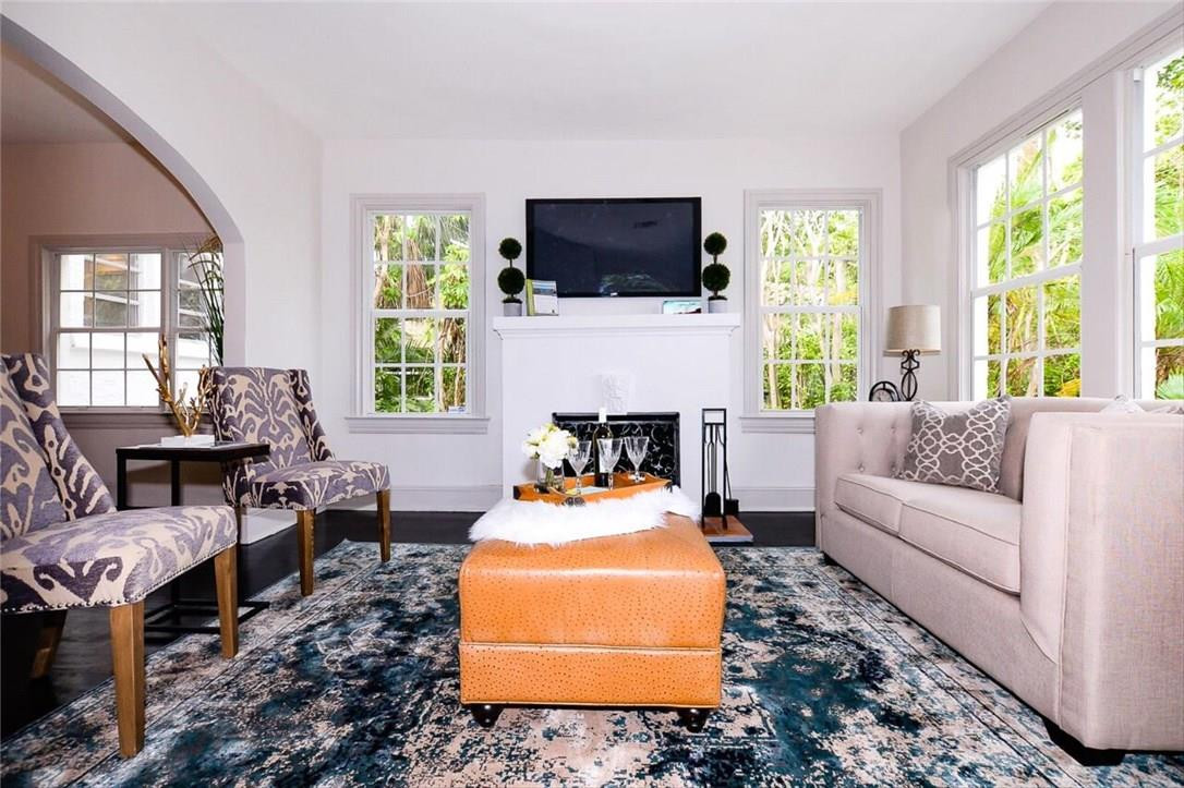 734 Avon Road West Palm Beach, FL 33401 - Photo 5 of 26 a living room with furniture fireplace and window