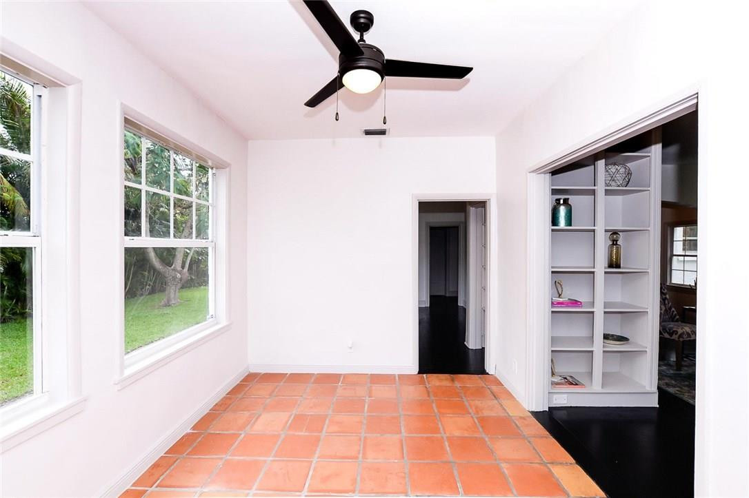 734 Avon Road West Palm Beach, FL 33401 - Photo 9 of 26 a bedroom with a bed and a window
