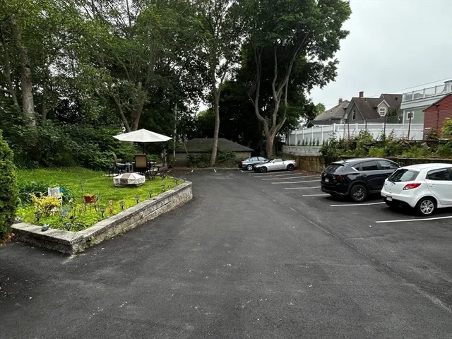 a view of street with parked cars