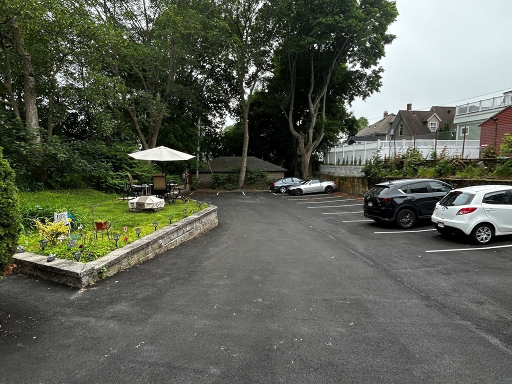 55 Hale Street, Unit 1 Beverly, MA 01915 - Photo 11 of 13 a view of a street with a car parked in the road