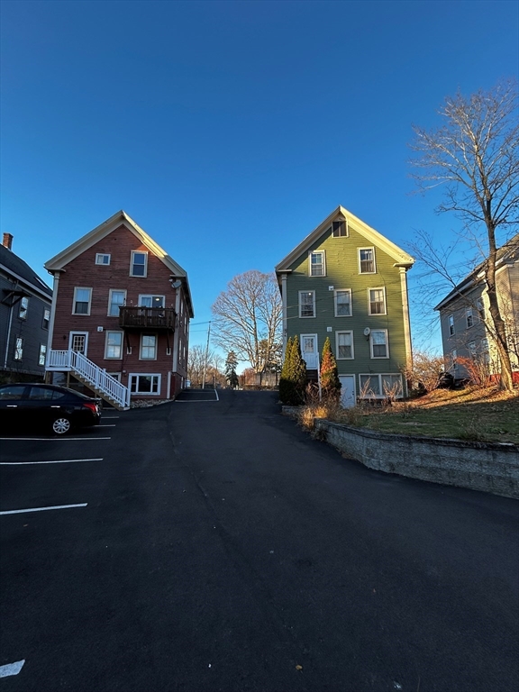 55 Hale Street, Unit 1 Beverly, MA 01915 - Photo 13 of 13 a front view of a house with a yard