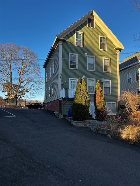 55 Hale Street, Unit 1 Beverly, MA 01915 - Photo 3 of 13 a front view of a house with garden