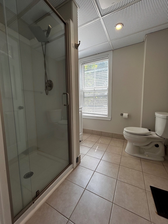 55 Hale Street, Unit 1 Beverly, MA 01915 - Photo 8 of 13 a bathroom with a toilet and a shower