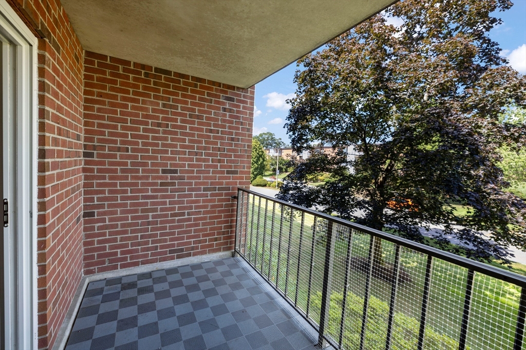 50-56 Broadlawn Park, Unit 221 Boston, MA 02467 - Photo 21 of 29 a view of a balcony