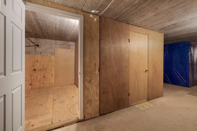 an empty room with wooden door